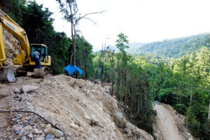 The Indonesian military clears trees for a segment of the Trans-Papua Highway in northern Papua.