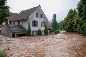 The flooded Kyll river rages through Erdorf, Germany in July, 2021. 