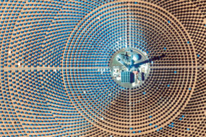 The Ouarzazate Solar Power Station, a multiphase solar power complex located in Morocco, is the world’s largest concentrated solar power plant, with an energy capacity of 510 megawatts. The third phase of the facility, the 820-foot Noor III tower seen here, uses 7,400 heliostat mirrors to focus the sun’s energy to heat molten salt to 500–1,022 degrees Fahrenheit, producing steam that generates electricity.