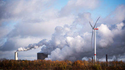 A wind turbine operating next to the Niederaussem coal-fired power plant near Bergheim, Germany.