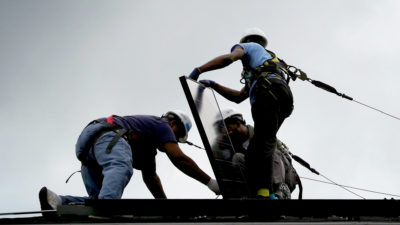 Workers in Washington, D.C. install the one millionth solar panel in the U.S. last May.