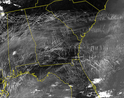 An infrared satellite image showing dozens of contrails over the southeastern United States during a single morning in January 2004.
