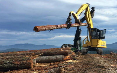 A crew in southwestern Oregon hauls logs that will be used to manufacture mass timber.