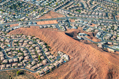 St. George, Utah has been growing rapidly, with subdivisions and golf courses pushing into the desert. Its population has grown from 20,000 to 150,000 in the last 20 years.