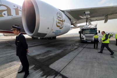 An Emirates ground crew fills an Airbus A380 with sustainable fuel for a demonstration flight at Dubai International Airport on November 22, 2023.