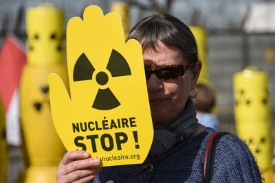 An activist in March 2017 demanding closure of the Fessenheim Nuclear Power Plant in France. Authorities announced in April that they will close the facility by 2020.