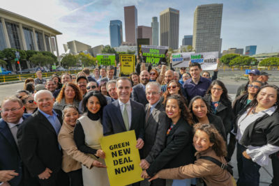 Los Angeles Mayor Eric Garcetti, center, announced this week that the city will phase out three natural gas power plants and replace them with renewables.