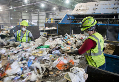 Workers sort recycling material at a waste management facility in Elkridge, Maryland. 