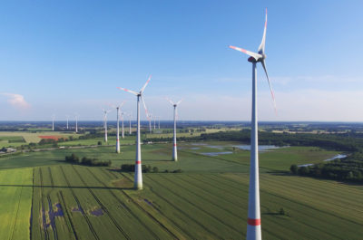 Wind turbines near Brueck, Germany in June 2016. Germany's nearly 30,000 wind turbines combined equal the power generation of about 10 nuclear reactors.