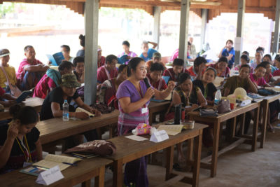 Naw Knyaw Paw, of the Salween Peace Park Governing Committee, explains the park's founding charter during a park-wide general assembly meeting.