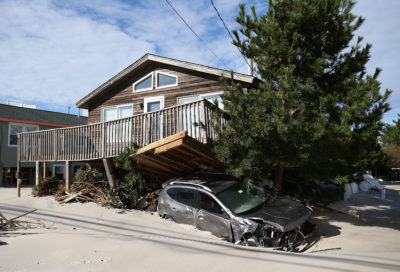 A house and car on Long Beach Island damaged in 2012 by Hurricane Sandy.