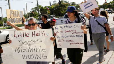 Demonstrators protest a proposed development project in Miami's Little Haiti neighborhood in 2019, arguing it will displace longtime residents.