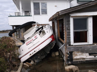This bungalow owned by David Rinear off Long Beach Island, New Jersey, was totaled during Hurricane Sandy by an unmoored boat that crashed ashore.