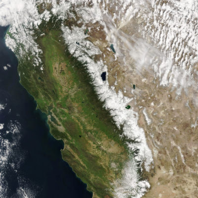 California's Sierra Nevada mountains in March 2010 (left), a typical year for snowpack, and in March 2021 (right), a drought year.