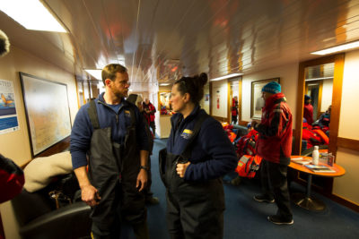 Marine scientist Holly Morin and a colleague from the University of Rhode Island wait to be transported off the Akademik Ioffe. The 36-member team of researchers were onboard to study the opening up of the Northwest Passage.