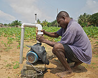 Ghana farmer uses water pump
