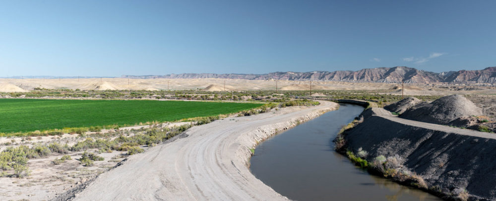 A system of canals, pipes, and ditches irrigate 23,000 acres of farmland in the Grand Valley with water from the Colorado River.
