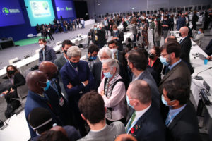 Delegates confer in the final hours of the Glasgow climate talks.