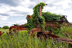 Overgrown agricultural machinery on a vacant farm near the Chernobyl Nuclear Power Plant in Ukraine.