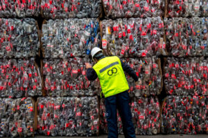 A worker examines plastic bottles at a recycling center in Santiago, Chile. 