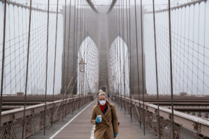 A woman walks on the Brooklyn Bridge on March 20.