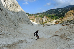 A worker collects sand at a mine near Port au Prince, Haiti in April 2014.