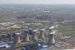 A coal power plant near large housing developments outside Tianjin, China.