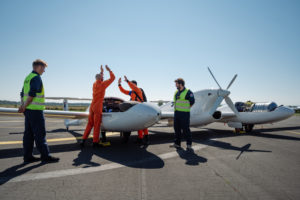 Pilots celebrate after a successful flight in an aircraft powered by liquid hydrogen at Maribor Airport in Slovenia on September 7, 2023.
