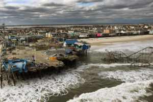 Wreckage of an amusement park in Seaside Heights, New Jersey after Superstorm Sandy in 2012. New Jersey is suing oil companies for damages from climate-fueled disasters.