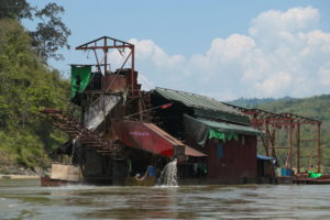 A gold-dredging boat on the Mali River in Kachin State, Myanmar.