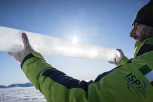 Researcher Andrea Spolaor holds an ice core recovered in Svalbard, Norway in April 2023.
