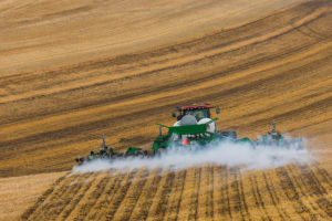A tractor applies conventional ammonia fertilizer on a field in eastern Washington.