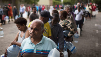 After Cape Town restricted water use in February to 13 gallons per day per person, city residents now wait in increasingly long lines to collect water from the city's natural springs. 