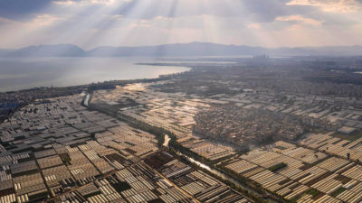 Greenhouse roofs reflect sunlight in Kunming, China.