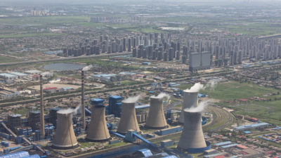 A coal power plant near large housing developments outside Tianjin, China.