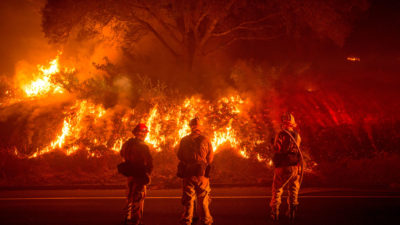 Firefighters battle a wildfire near Mariposa, California.