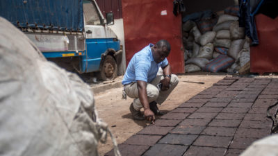 An engineer inspects paving blocks made from recycled plastics in a suburb of Accra, Ghana.