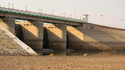 A dried-up reservoir behind a dam in North Karnataka, India.