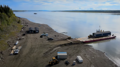 A prefabricated house delivered by barge to the Sahtu village of Tulita in 2022. Recent deliveries have been cancelled because of low water levels on the Mackenzie River.