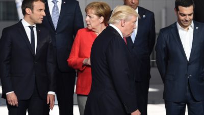 President Trump with French President Emmanuel Macron (left) and German Chancellor Angela Merkel at the NATO summit in Brussels last month.