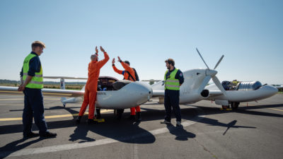 Pilots celebrate after a successful flight in an aircraft powered by liquid hydrogen at Maribor Airport in Slovenia on September 7, 2023.
