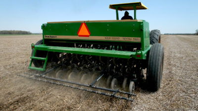 A farmer near Bowling Green, Ohio plants soybeans using a no-till drill. Untilled soil stores more carbon.