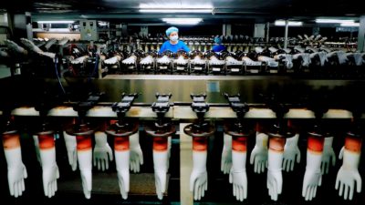 PVC gloves on a production line in Rugao, China.

