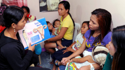 Women being informed about birth control at the Likhaan Center for Women’s Health in Manila, Philippines. 