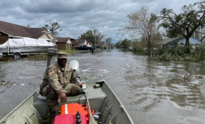 A Louisiana National Guardsman surveys damage from Hurricane Ida in LaPlace, Louisiana, September 1, 2021.