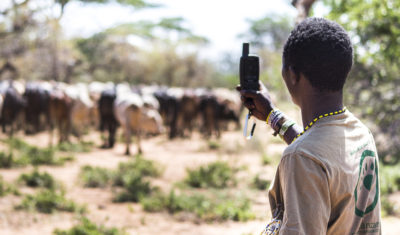 A Hadza scout tracks illegal cattle grazing.