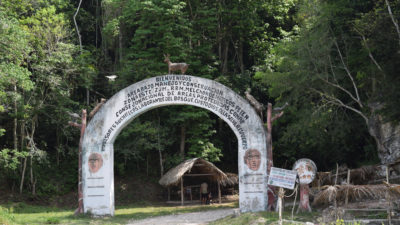 The entrance to a multiple-use zone, where sustainable logging and harvesting are permitted, in a community forest concession in the Maya reserve.