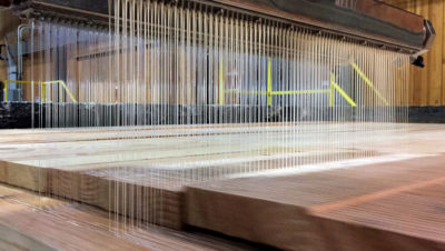 Glue is applied to create cross-laminated timber at the D.R. Johnson Lumber Company in Riddle, Oregon, one of the first mass timber-certified manufacturers in the U.S.