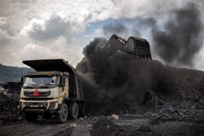 Coal is loaded onto a truck at an open-pit mine near Dhanbad, India, in September.