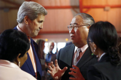 John Kerry, then U.S. secretary of state, with China's special representative on climate change, Xie Zhenhua, at the 2015 Paris climate conference.